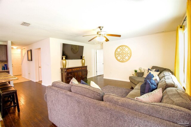 2191 Waltham St, Pensacola, FL 32505 - living room featuring ceiling fan, dark wood-type flooring, and baseboards