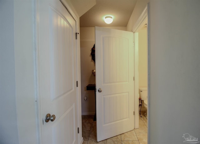 hallway featuring light tile patterned flooring