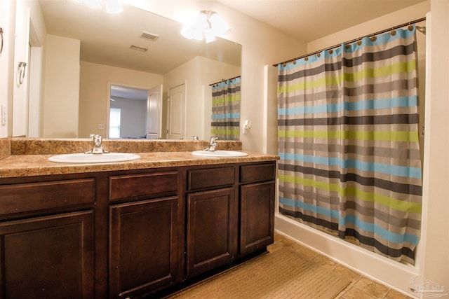 bathroom with vanity, a shower with curtain, and tile patterned flooring