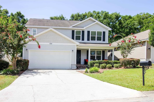 2191 Waltham St, Pensacola, FL 32505 - view of front of property featuring covered porch, a front yard, an attached garage, and driveway