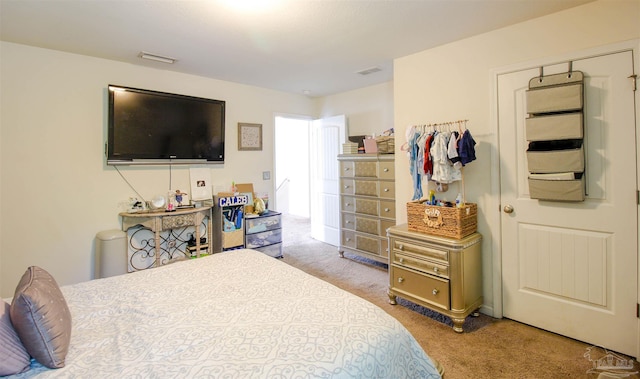 bedroom with light carpet