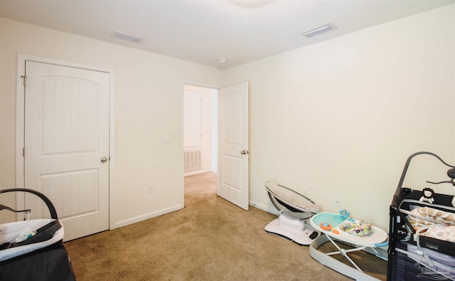 misc room with light colored carpet