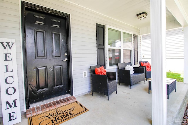 entrance to property featuring a porch