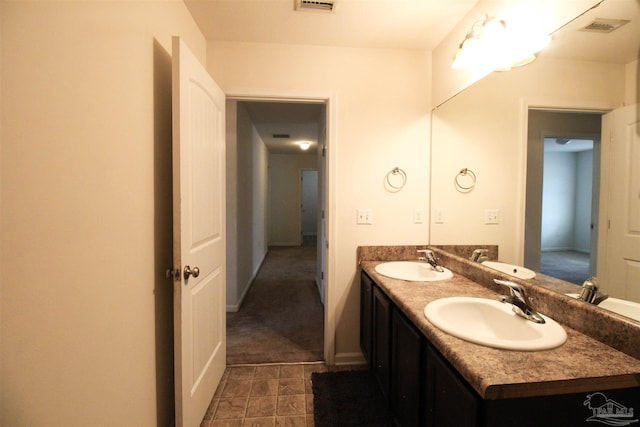 2191 Waltham St, Pensacola, FL 32505 - bathroom with double vanity and baseboards