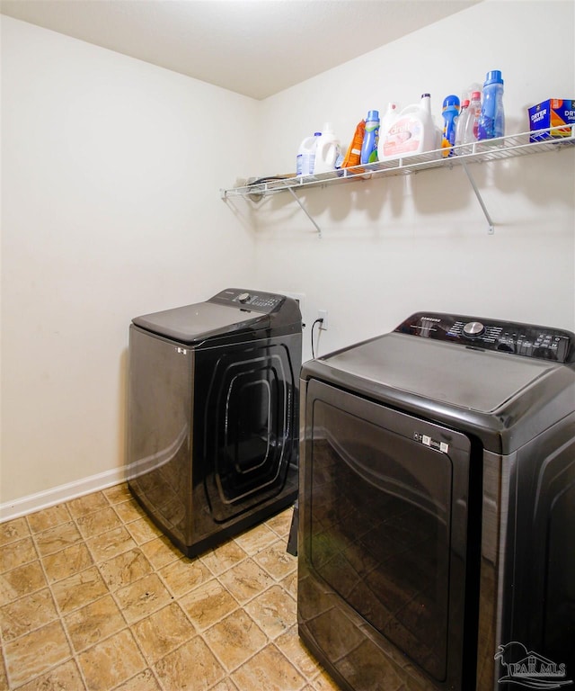 clothes washing area featuring washer and dryer