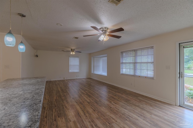 3255 Newton Dr, Pensacola, FL 32503 - unfurnished room with a textured ceiling, wood finished floors, and ceiling fan
