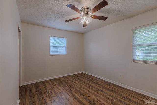 unfurnished room with a textured ceiling, ceiling fan, and dark hardwood / wood-style floors