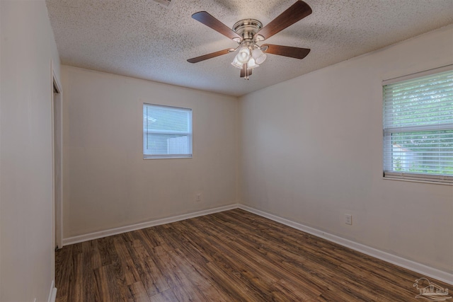 3255 Newton Dr, Pensacola, FL 32503 - spare room featuring dark wood-style floors, a textured ceiling, and ceiling fan