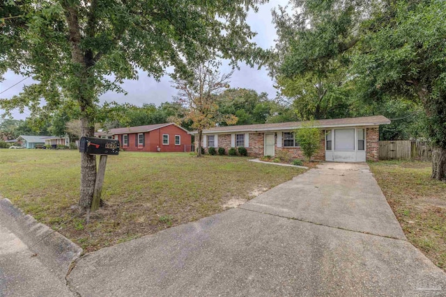 3255 Newton Dr, Pensacola, FL 32503 - single story home featuring concrete driveway and brick siding