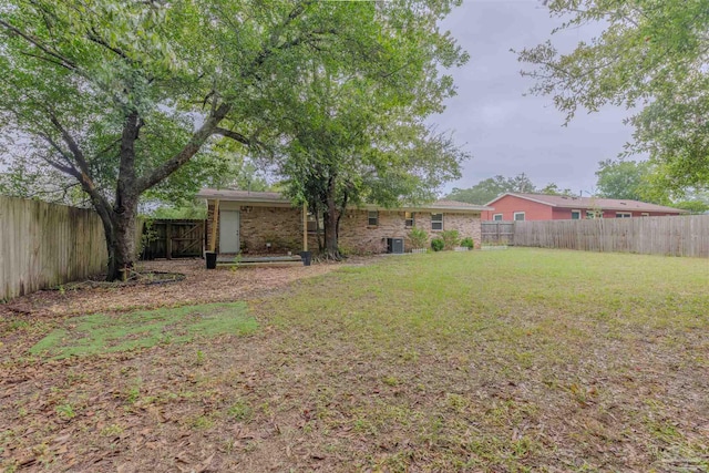 view of yard with central AC