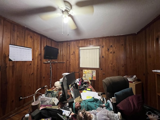 bedroom featuring wood walls and ceiling fan