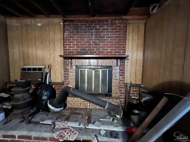 living room with an AC wall unit and wood walls