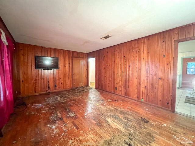 5457 Byrom St, Milton, FL 32570 - empty room with hardwood / wood-style floors and wooden walls