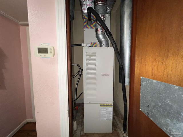 utility room with heating unit