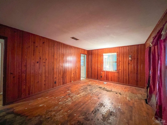 5457 Byrom St, Milton, FL 32570 - empty room with wood-type flooring and wooden walls