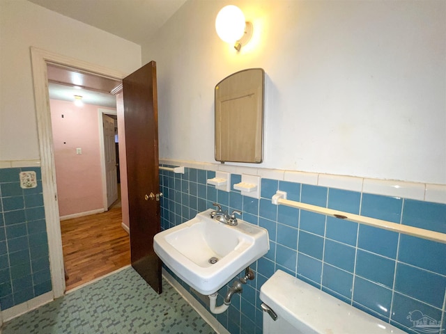 5457 Byrom St, Milton, FL 32570 - half bath featuring tile walls and wainscoting