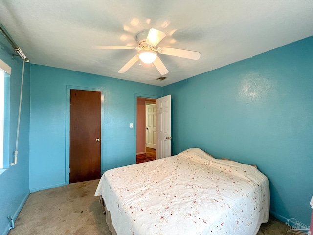5457 Byrom St, Milton, FL 32570 - carpeted bedroom with a ceiling fan and baseboards