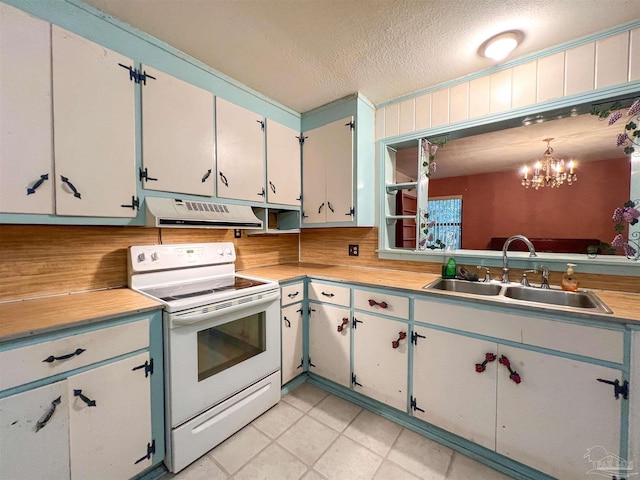 5457 Byrom St, Milton, FL 32570 - kitchen featuring white range with electric stovetop, ventilation hood, light countertops, a textured ceiling, and a chandelier