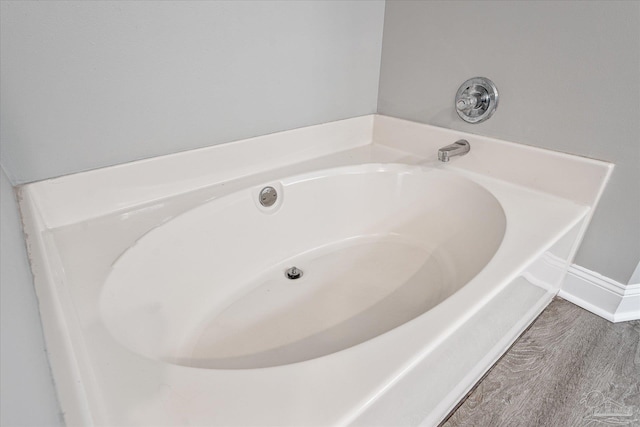 bathroom with a tub to relax in