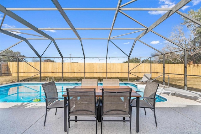 view of swimming pool with a patio and glass enclosure