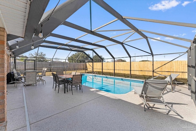 view of pool featuring a patio area and a lanai