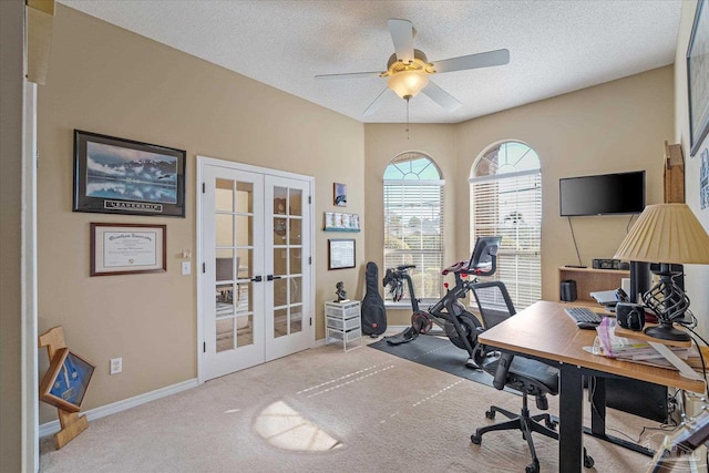 office area with french doors, a textured ceiling, and light colored carpet