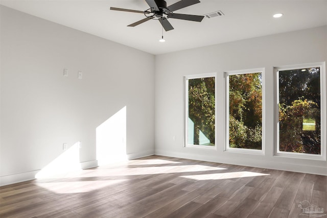 unfurnished room with hardwood / wood-style floors and ceiling fan