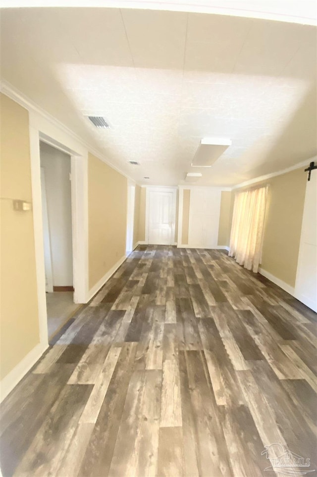 interior space with crown molding and dark hardwood / wood-style floors