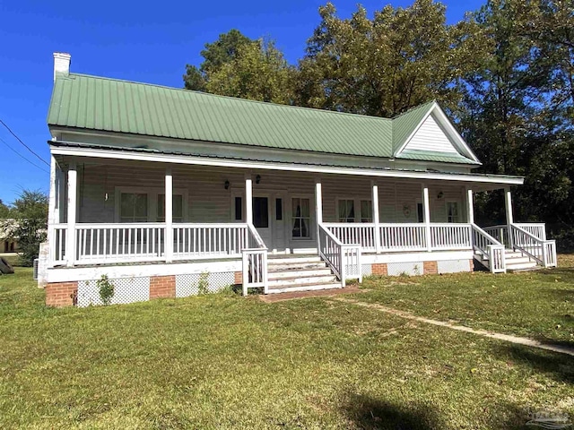 farmhouse with a front lawn and a porch