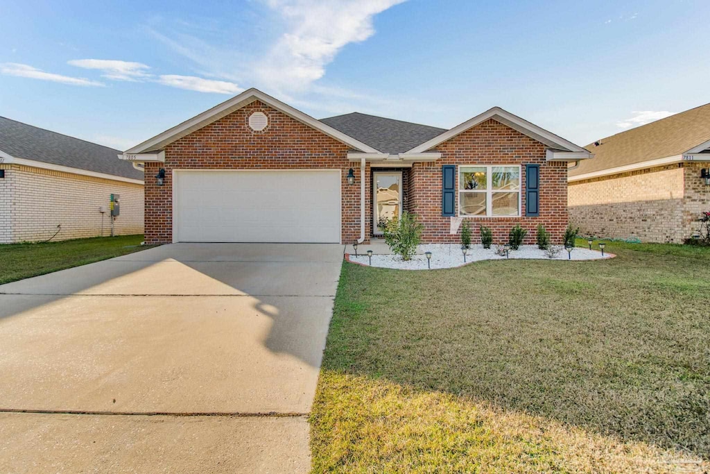 ranch-style home featuring a front yard and a garage