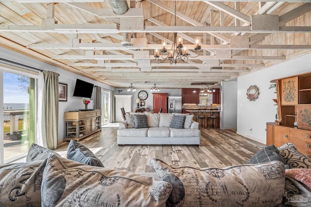 living room featuring wooden ceiling, an inviting chandelier, lofted ceiling with beams, and light wood finished floors