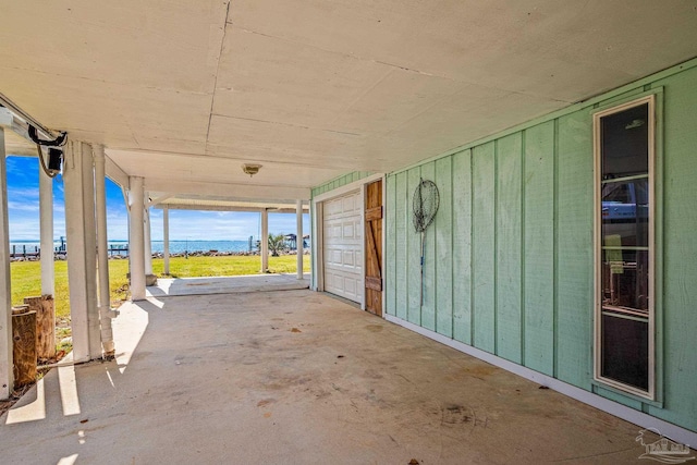 view of patio with a garage and a carport