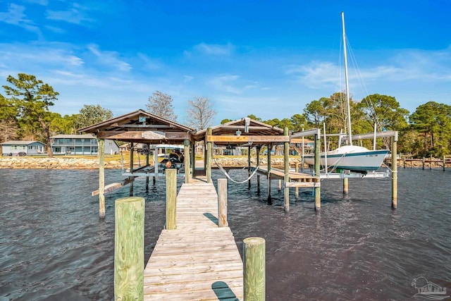 view of dock with a water view and boat lift