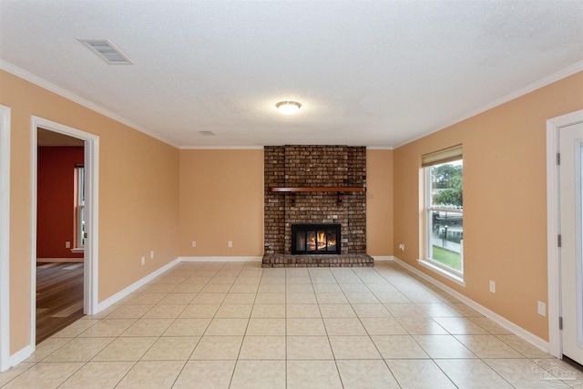 unfurnished living room featuring ornamental molding, a textured ceiling, and a brick fireplace