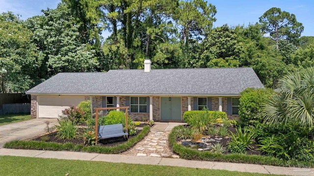 1370 Sanibel Ln, Gulf Breeze, FL 32563 - view of front of home featuring brick siding, an attached garage, concrete driveway, a chimney, and a shingled roof