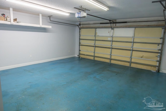 garage featuring baseboards and a garage door opener