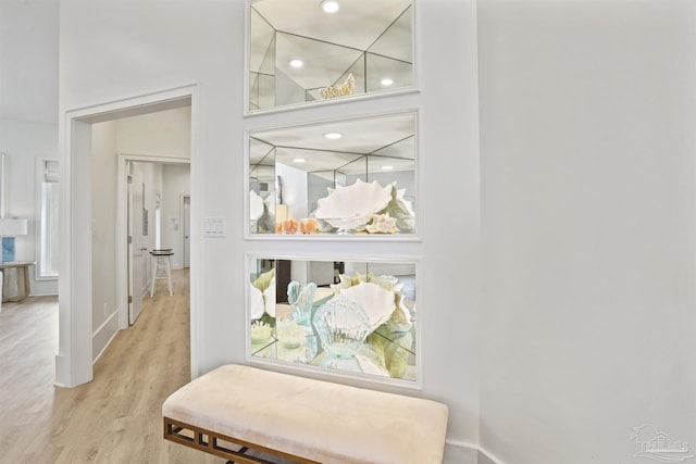 detailed view of wood finished floors, baseboards, and recessed lighting