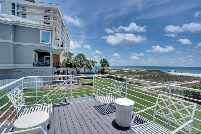 balcony with view of water and beach
