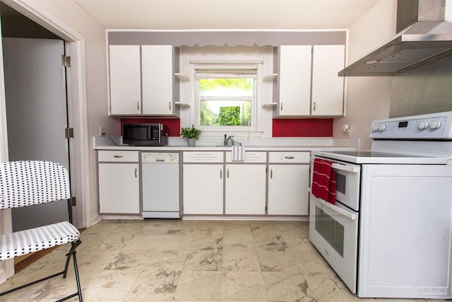 kitchen with white appliances, wall chimney exhaust hood, light countertops, and open shelves