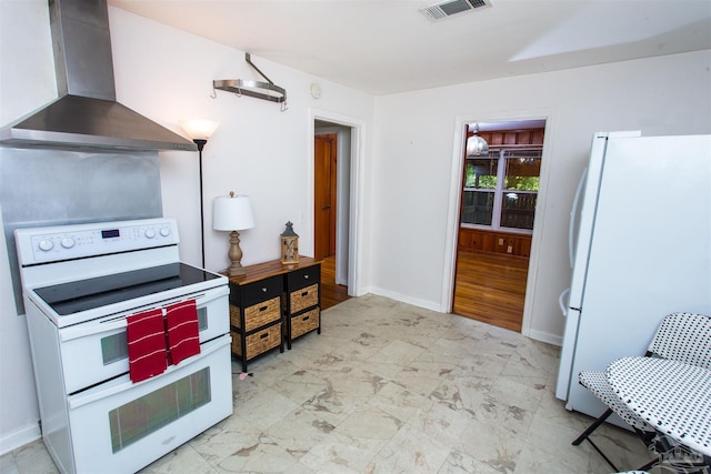kitchen with wall chimney range hood, baseboards, white appliances, and visible vents