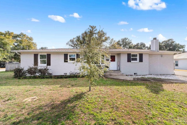ranch-style home featuring a front yard, crawl space, and a chimney