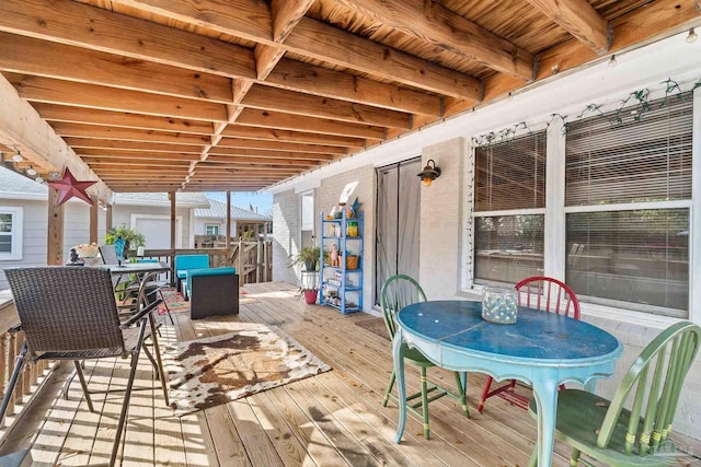 wooden deck featuring outdoor dining space