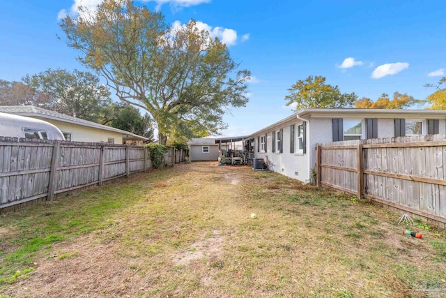 view of yard featuring a fenced backyard and cooling unit