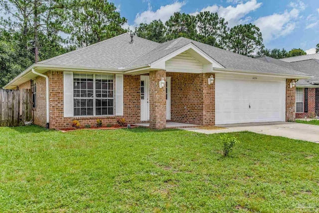 single story home featuring a garage and a front lawn