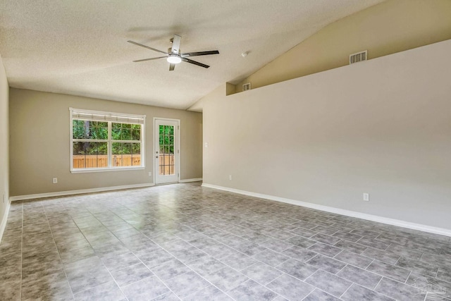 empty room featuring lofted ceiling, a textured ceiling, and ceiling fan