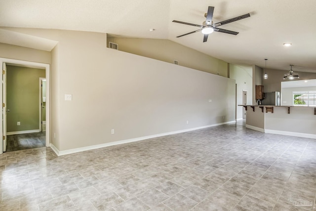 unfurnished living room with vaulted ceiling and ceiling fan