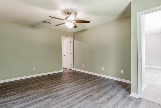 unfurnished room featuring hardwood / wood-style flooring, a textured ceiling, and ceiling fan