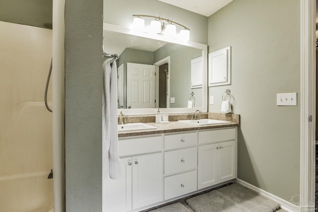 bathroom featuring vanity and walk in shower