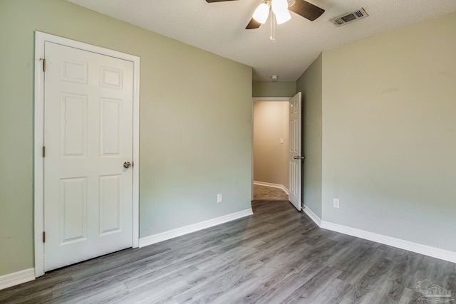 unfurnished bedroom featuring ceiling fan and light hardwood / wood-style flooring