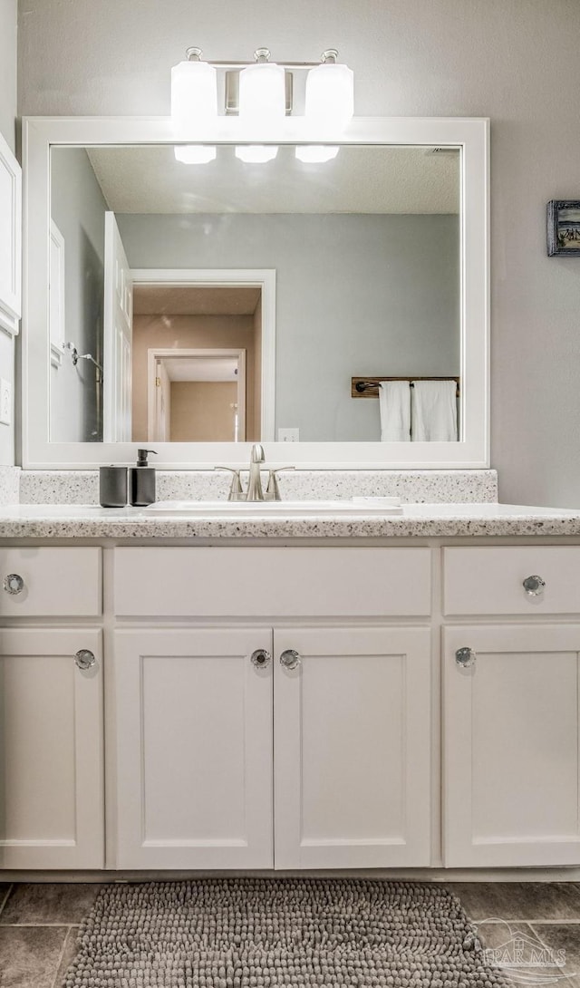 bathroom with vanity and tile patterned floors